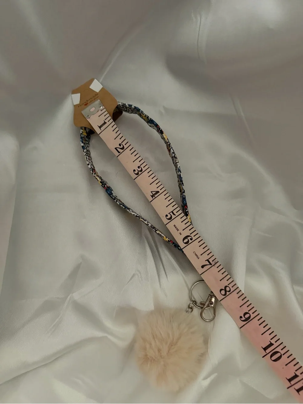 Handmade White and Blue Floral Wristlet Keychain with Beige Pompom